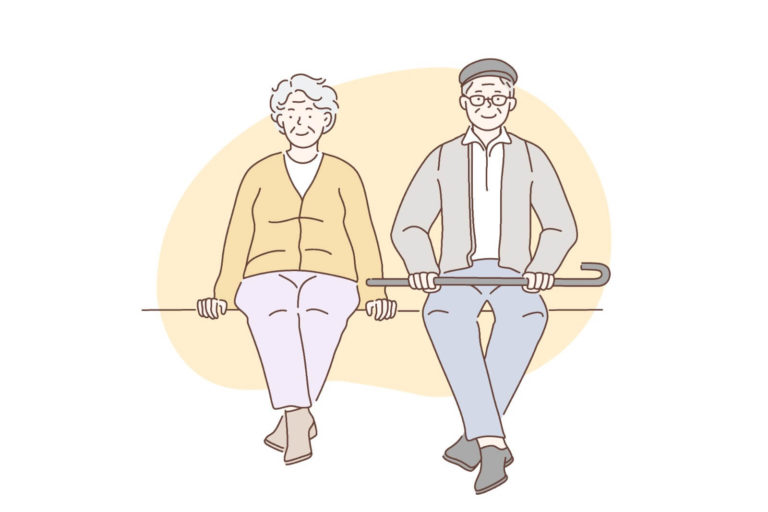 Sitzendes Ehepaar über 60 schaut nach vorne
